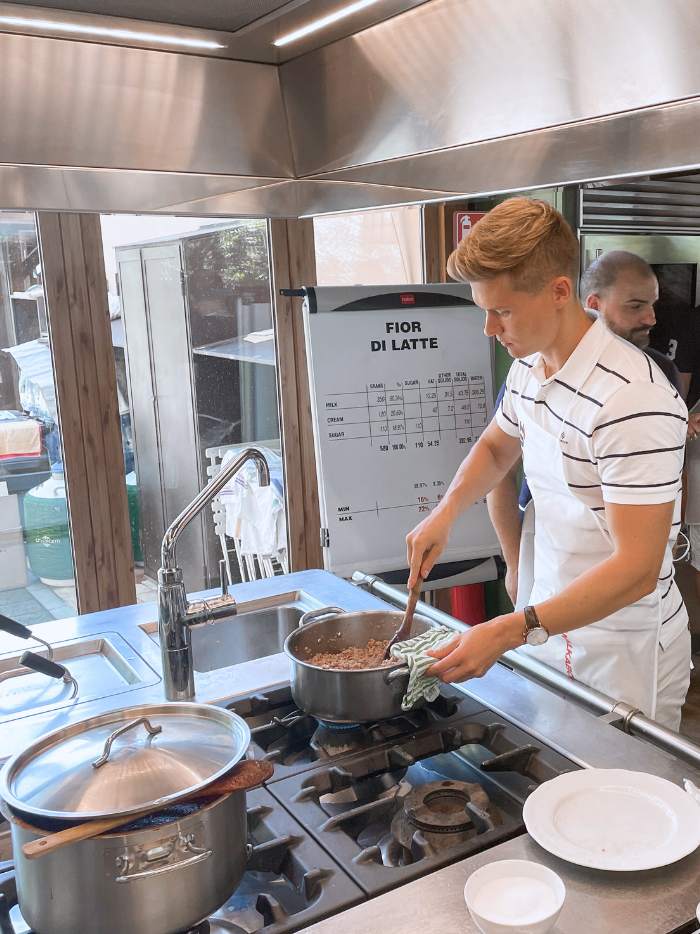 italian cook making pasta bolognese